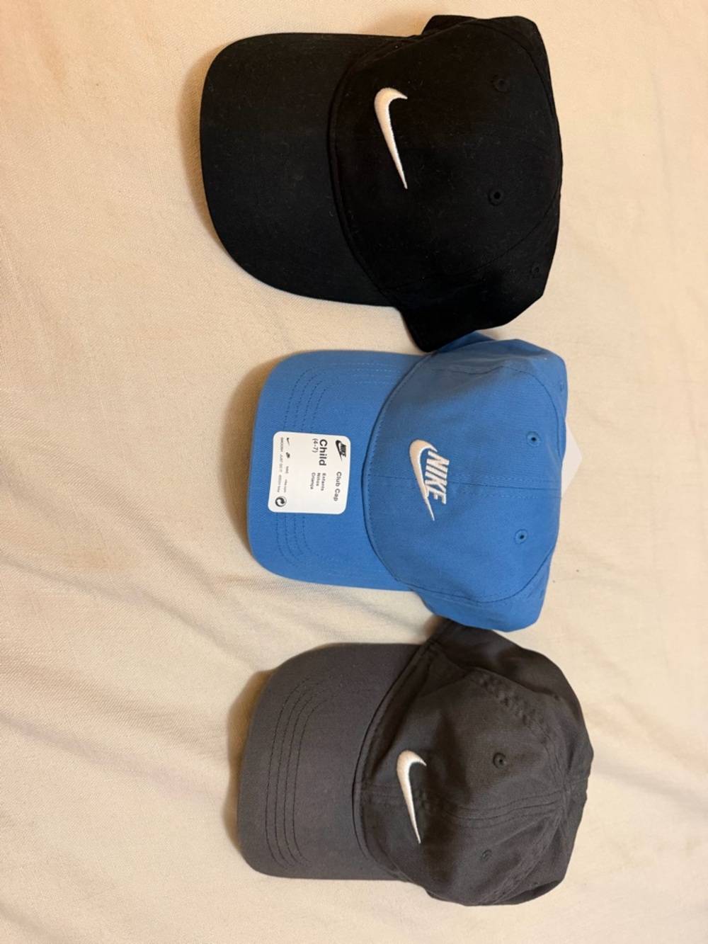 Nike kids Caps Trio — Black, Blue, Charcoal